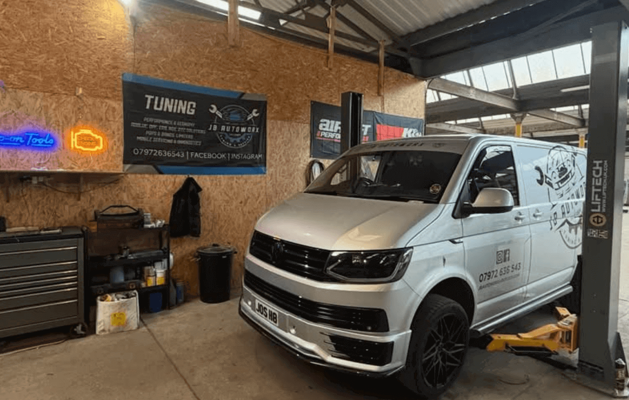 Mechanic performing routine maintenance on a car